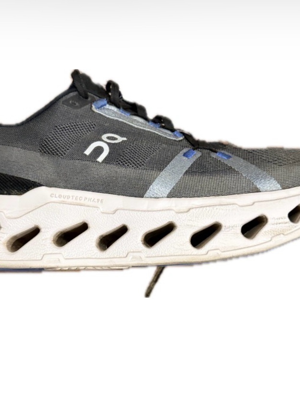 On Running Men's Trainer in Black, White and Blue Accents
